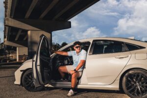 A Knoxville High School Senior Portrait of a guy getting out of his car