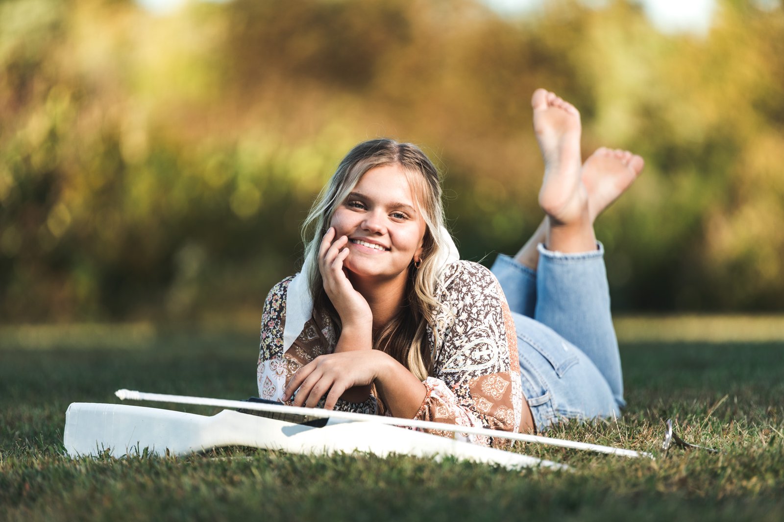 A Wintergard Knoxville high school, senior poses in a pretty field for her senior pictures
