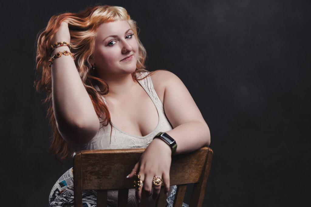 A Central High School Senior Poses in Studio For Her Senior Pics