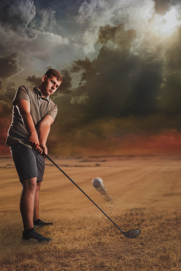 A golf high school student in Knoxville poses for an epic senior portrait experience