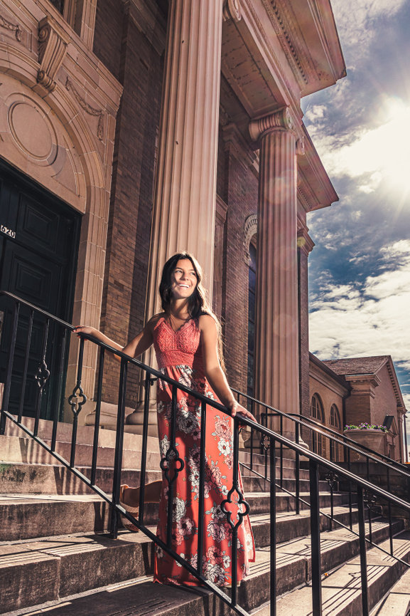 A Hardin Valley Academy HVA High School Senior Poses on steps