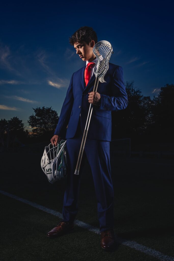 A Lacrosse Player Poses For Epic Senior Portriats